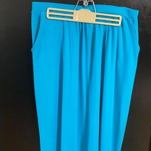 Aqua blue polyester, spandex material, mid calf